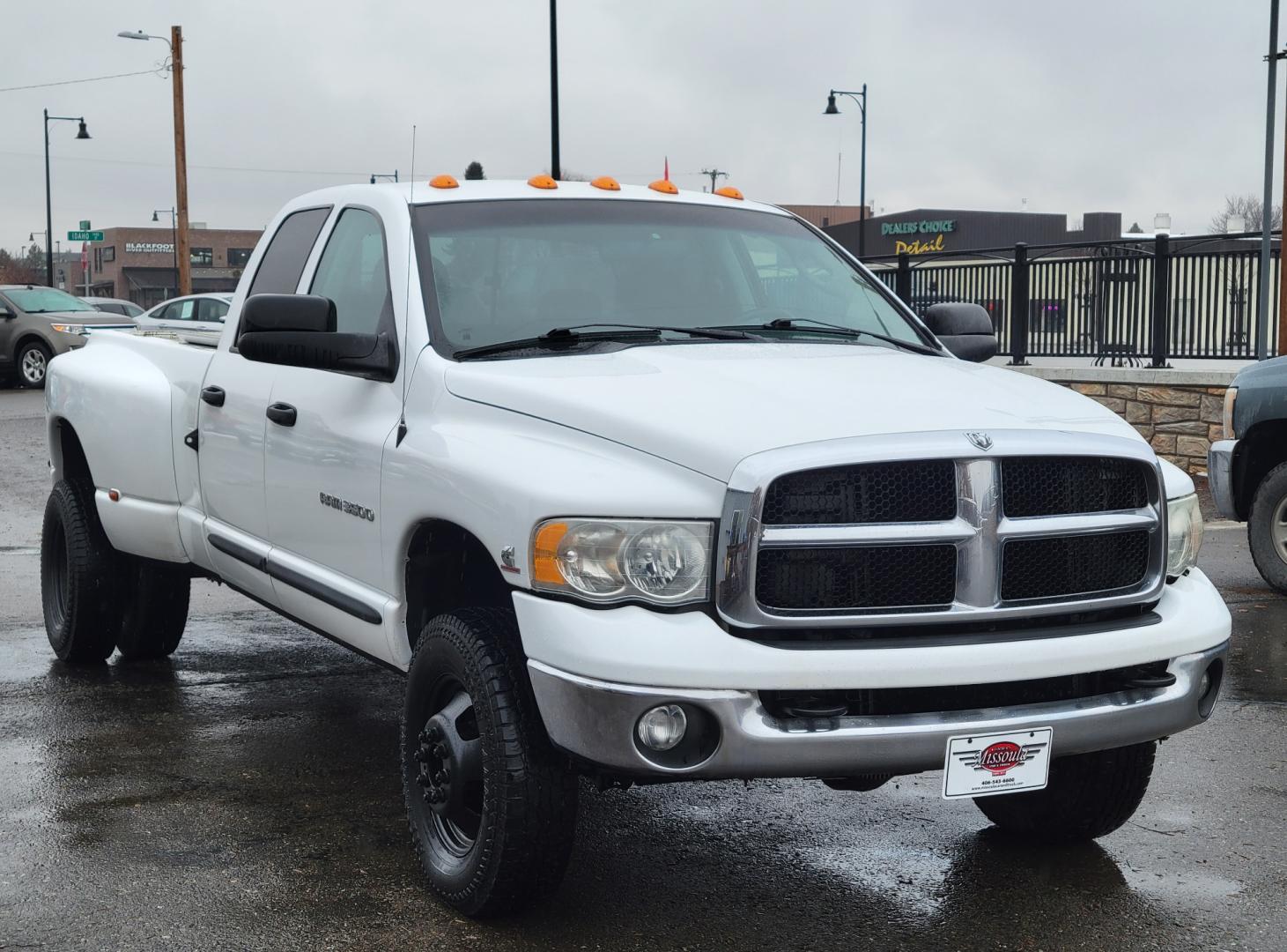 2005 White /Black Dodge Ram 3500 SLT (3D7LS38C85G) with an 5.9L I6 24V Cummins engine, 6 Speed Manual transmission, located at 450 N Russell, Missoula, MT, 59801, (406) 543-6600, 46.874496, -114.017433 - 4 Wheel Drive. One Ton Dually. Long Box. 6 Speed Manual Transmission. Has a lot of miles but runs amazingly. Air Cruise. Tilt. Power Windows and Locks. Power Drivers Seat. AM FM CD XM. 1 Owner. Clean Carfax. There is no financing options on this vehicle. - Photo#3